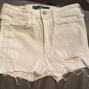 Slightly distressed Holister white jean shorts